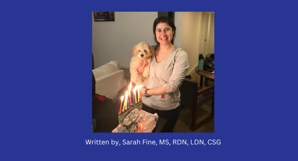 Image of blue, white, silver balls, with star of David stating Happy Hanukkah 